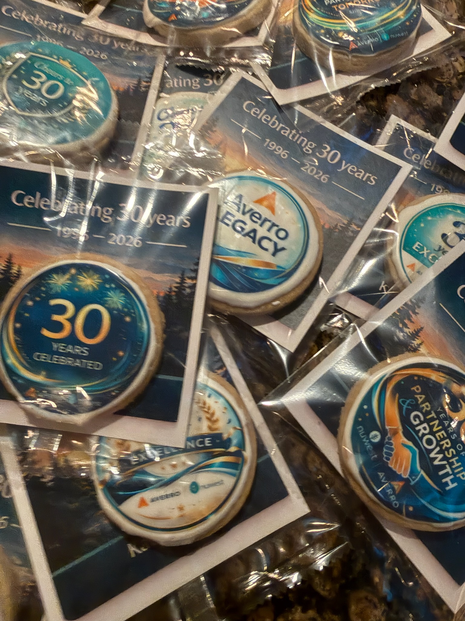 Corporate anniversary celebration cookies with company branding