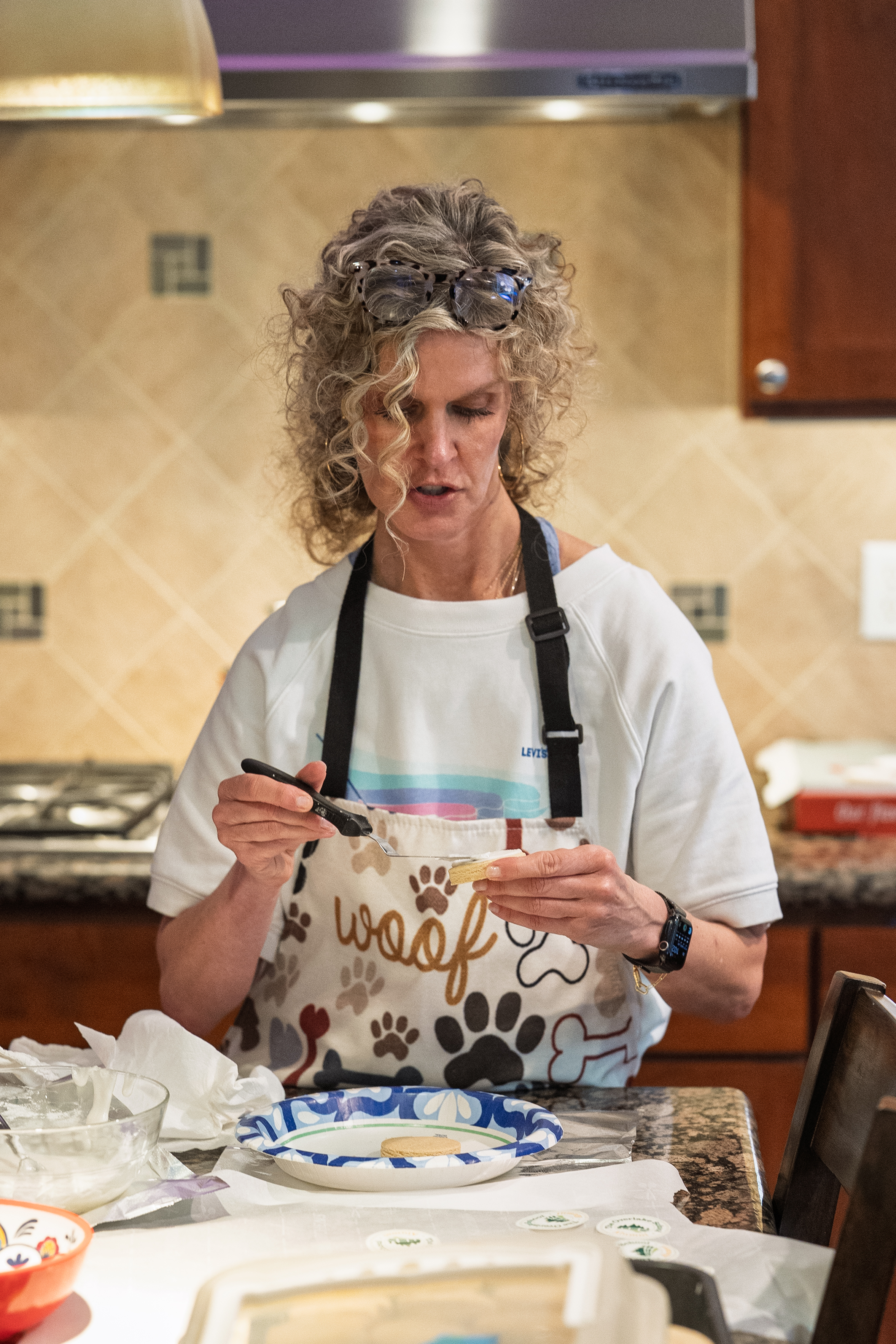 Shelly assembling cookies in the kitchen